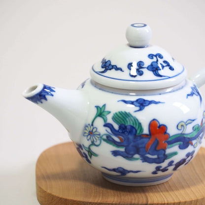 Looking at the spout of a Kyoto-yaki teapot with a colorful dragon design by Shoami.